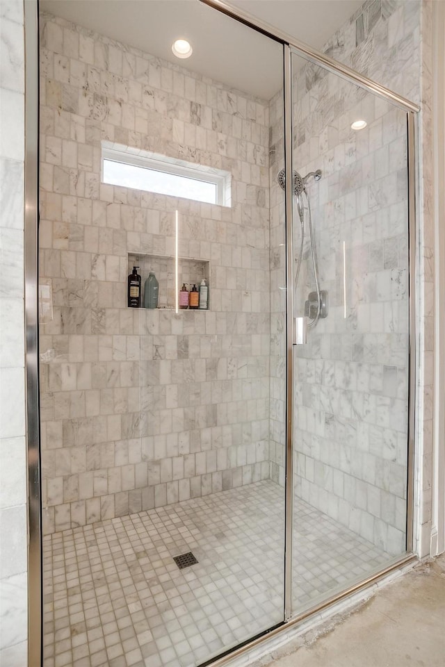 bathroom featuring a shower stall