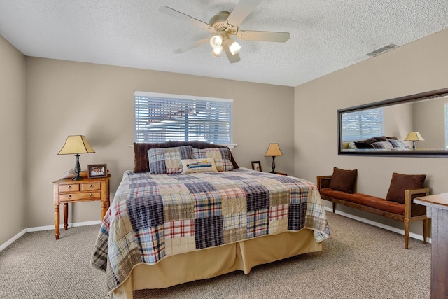 bedroom featuring multiple windows, carpet, visible vents, and baseboards