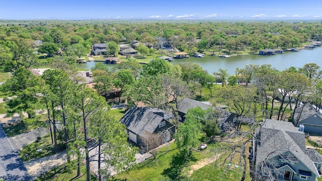 bird's eye view with a forest view, a water view, and a residential view