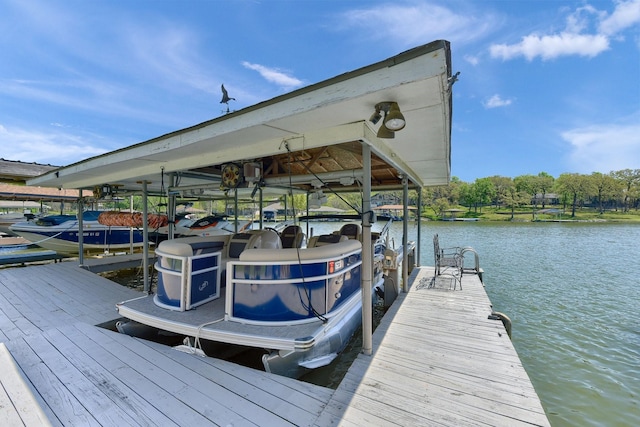 dock area featuring a water view and boat lift