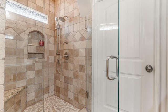 full bathroom with a shower stall