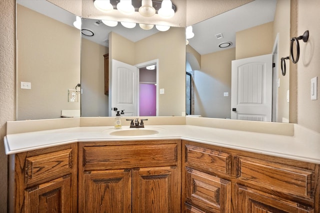 bathroom with vanity and visible vents