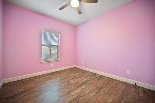 unfurnished room with baseboards, a ceiling fan, and wood finished floors
