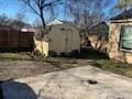 view of home's exterior featuring a shed