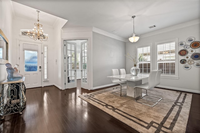 dining space with dark wood-style flooring, visible vents, and crown molding