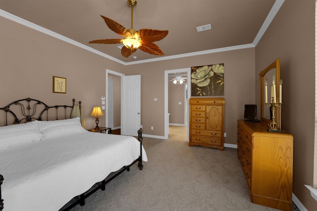 bedroom featuring light carpet, baseboards, visible vents, and crown molding