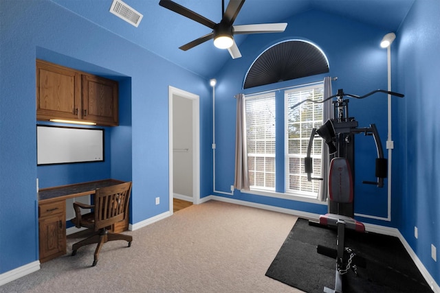 office with light colored carpet, visible vents, vaulted ceiling, ceiling fan, and baseboards