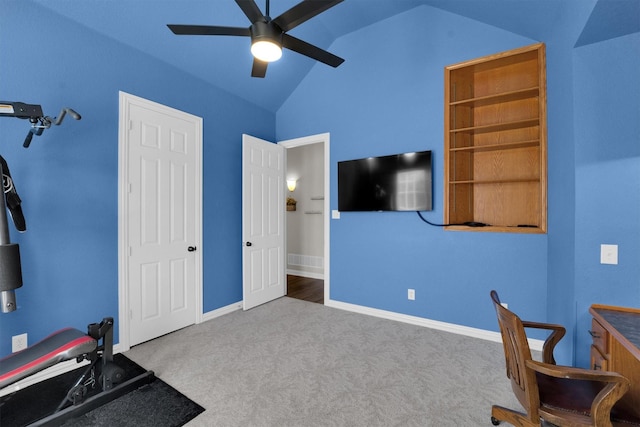 interior space with lofted ceiling, light colored carpet, ceiling fan, and baseboards