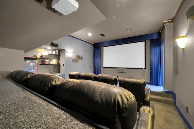 carpeted home theater with visible vents and baseboards