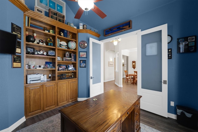 home office featuring a ceiling fan, dark wood-style flooring, and vaulted ceiling