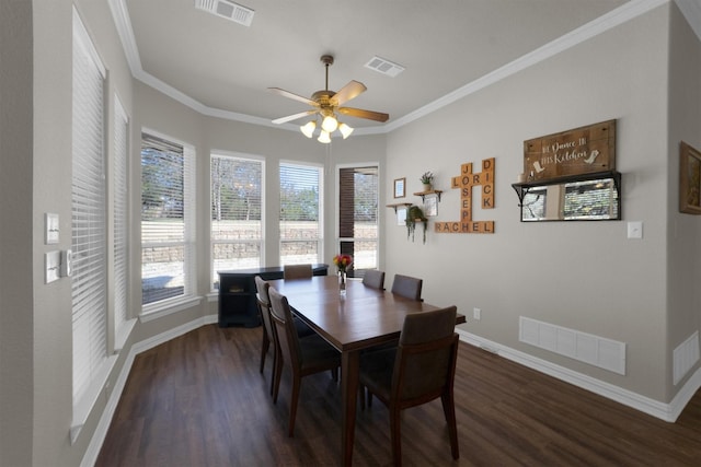 dining area with dark wood-type flooring, visible vents, and crown molding