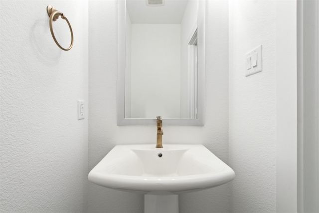 723 Prosper Ln, Wylie, TX 75098 - bathroom featuring a sink and a textured wall