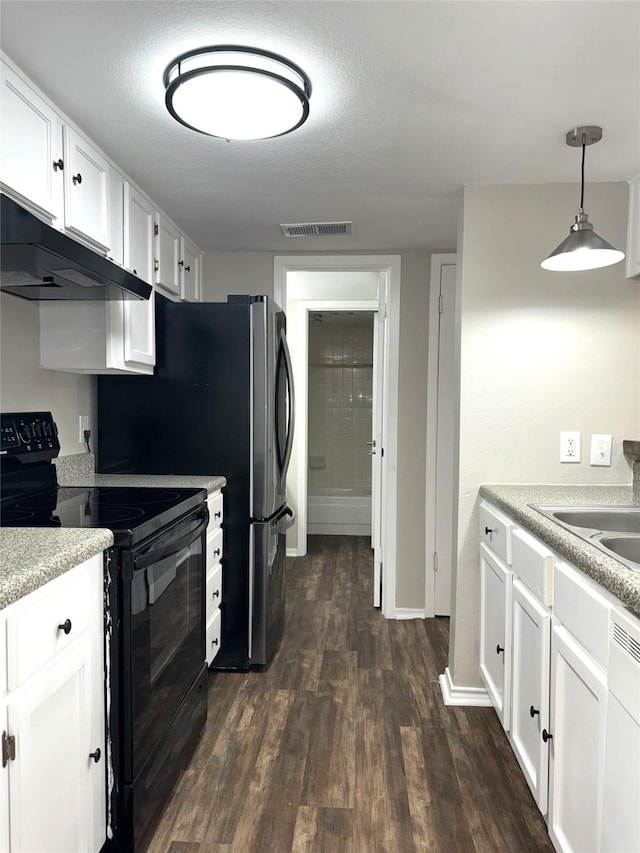 kitchen featuring hanging light fixtures, white cabinetry, black / electric stove, and light countertops