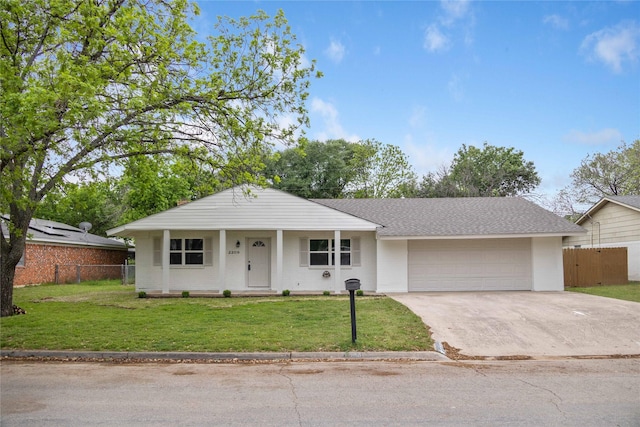 2209 9th St, Brownwood, TX 76801 - view of front of house featuring a garage, concrete driveway, and a shingled roof
