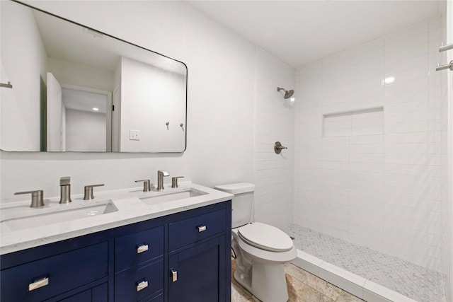 2209 9th St, Brownwood, TX 76801 - full bath featuring toilet, a tile shower, and double vanity