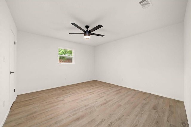 2209 9th St, Brownwood, TX 76801 - spare room featuring light wood finished floors, a ceiling fan, and baseboards