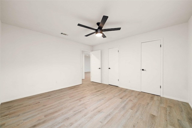 2209 9th St, Brownwood, TX 76801 - unfurnished bedroom featuring light wood-style floors, baseboards, and ceiling fan
