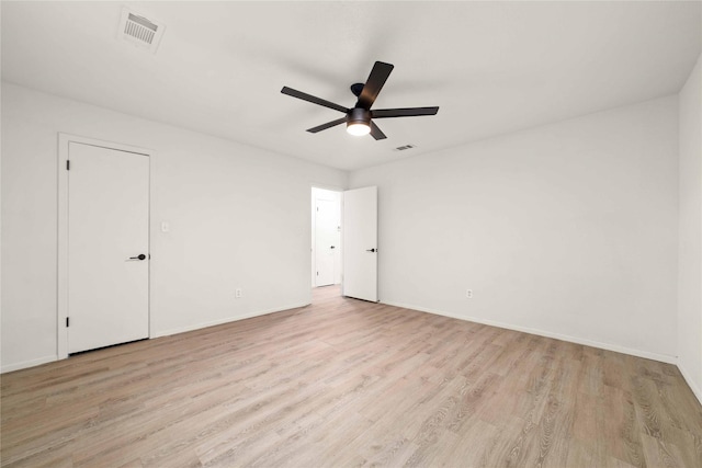 2209 9th St, Brownwood, TX 76801 - unfurnished bedroom with wood finished floors, baseboards, and ceiling fan