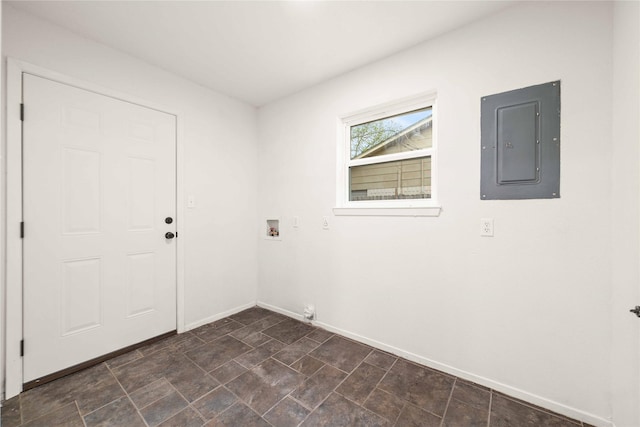 2209 9th St, Brownwood, TX 76801 - laundry room featuring electric panel, baseboards, and hookup for a washing machine