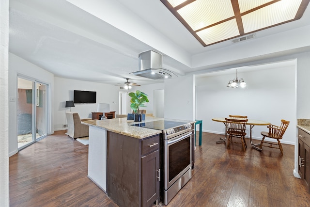 kitchen featuring island range hood, electric stove, dark wood-style flooring, decorative light fixtures, and dark brown cabinets