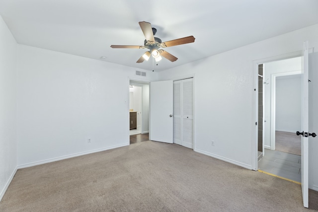 unfurnished bedroom featuring baseboards, visible vents, ceiling fan, and light colored carpet