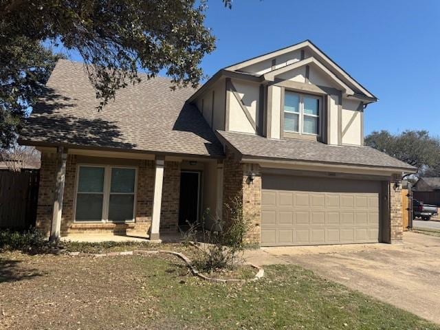 view of front of house with concrete driveway, brick siding, an attached garage, and a shingled roof