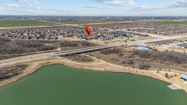 birds eye view of property featuring a residential view and a water view