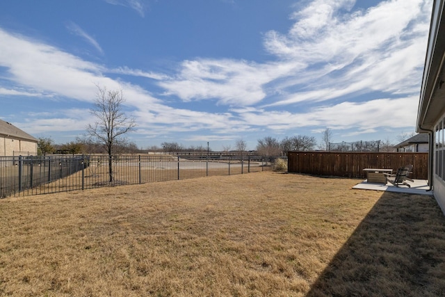 view of yard featuring a patio area and a fenced backyard