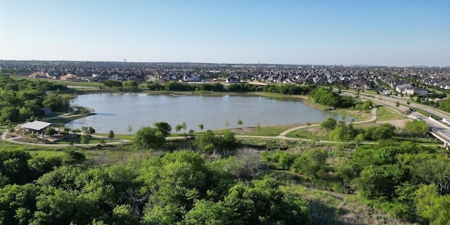 drone / aerial view with a water view and a residential view