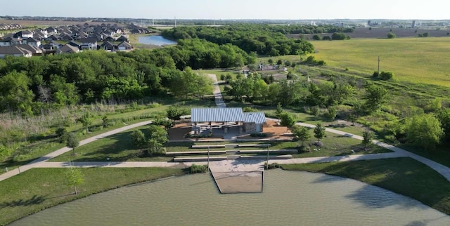 bird's eye view with a residential view and a water view