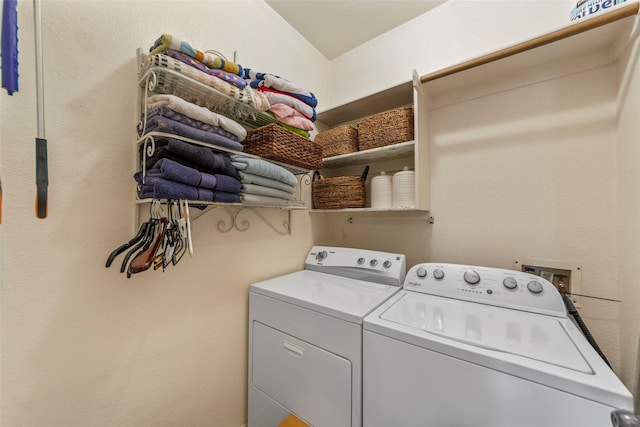 clothes washing area featuring separate washer and dryer