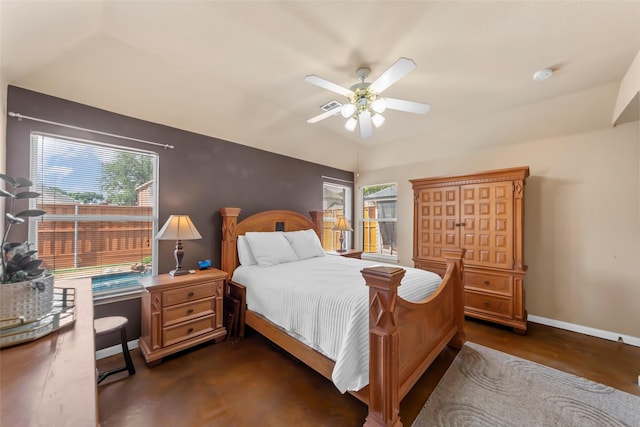 bedroom featuring baseboards, lofted ceiling, and ceiling fan