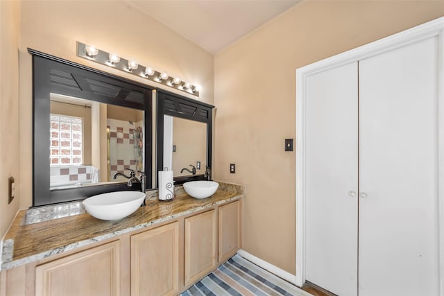 bathroom featuring double vanity