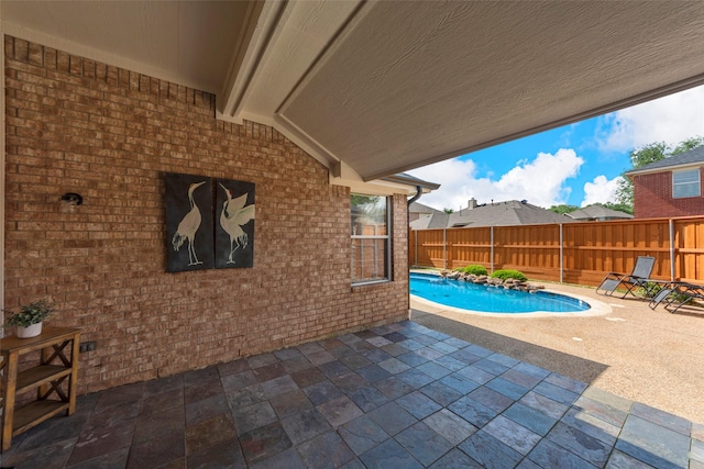 view of pool featuring a patio and a fenced backyard