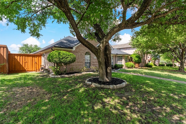 ranch-style home featuring brick siding