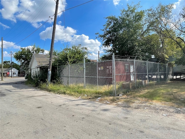 view of gate with fence