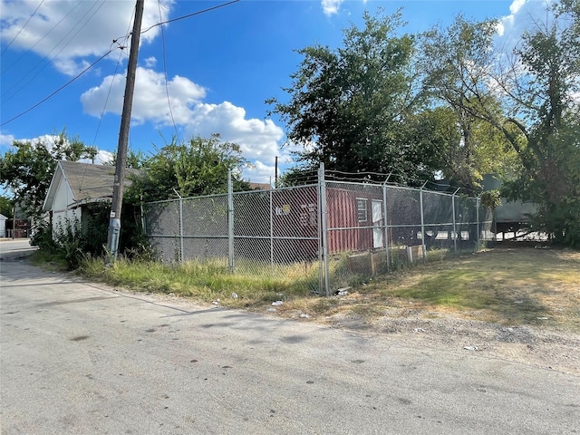 view of gate featuring fence