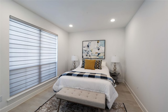 bedroom with baseboards and recessed lighting