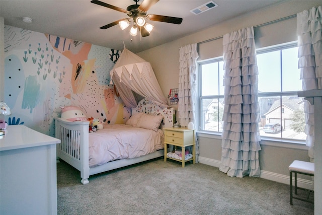 carpeted bedroom with baseboards, ceiling fan, visible vents, and wallpapered walls