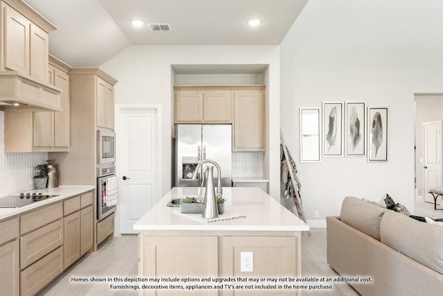13133 Yellowstone Way, Providence Village, TX 76227 - kitchen featuring appliances with stainless steel finishes, light countertops, visible vents, and an island with sink
