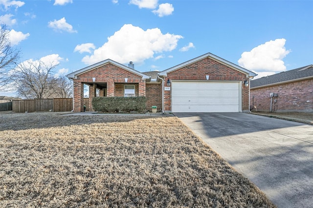 single story home with driveway, a chimney, an attached garage, fence, and brick siding