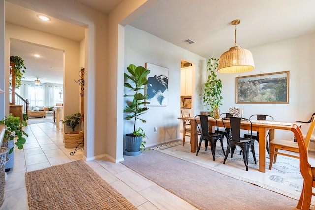 dining room featuring light tile patterned floors, recessed lighting, light colored carpet, visible vents, and baseboards