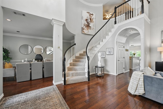 2781 Timber Crest Ln, Highland Village, TX 75077 - foyer entrance featuring hardwood / wood-style flooring, a high ceiling, stairway, ceiling fan, and arched walkways