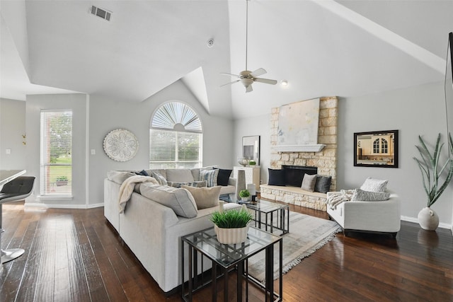 2781 Timber Crest Ln, Highland Village, TX 75077 - living room featuring dark wood finished floors, baseboards, ceiling fan, a stone fireplace, and lofted ceiling