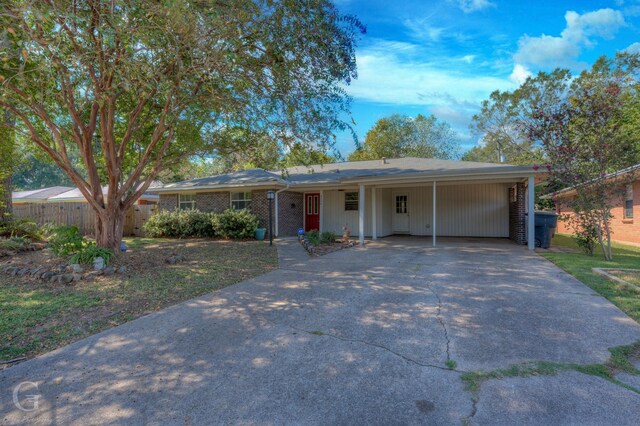 4606 Tibbs St, Shreveport, LA 71105 - single story home with concrete driveway and an attached carport