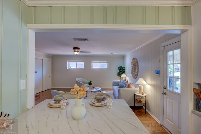 4606 Tibbs St, Shreveport, LA 71105 - dining area featuring crown molding, light wood-style floors, and baseboards