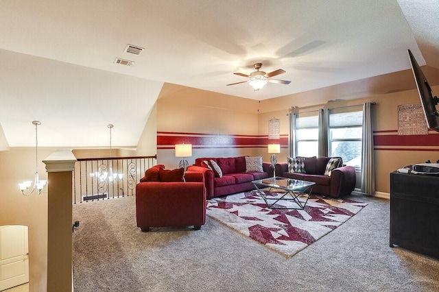 carpeted living area featuring visible vents and ceiling fan with notable chandelier