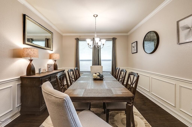 dining area featuring a wainscoted wall, crown molding, dark wood finished floors, and a notable chandelier