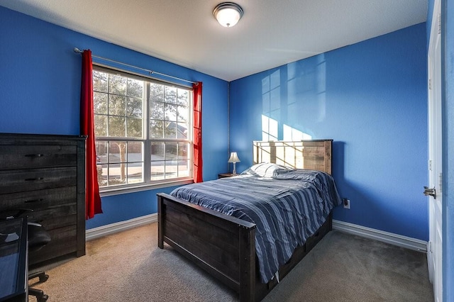 carpeted bedroom with baseboards