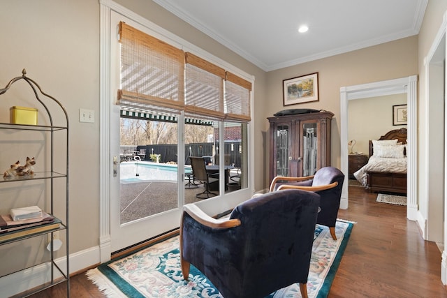 living area featuring baseboards, dark wood-style flooring, recessed lighting, and crown molding